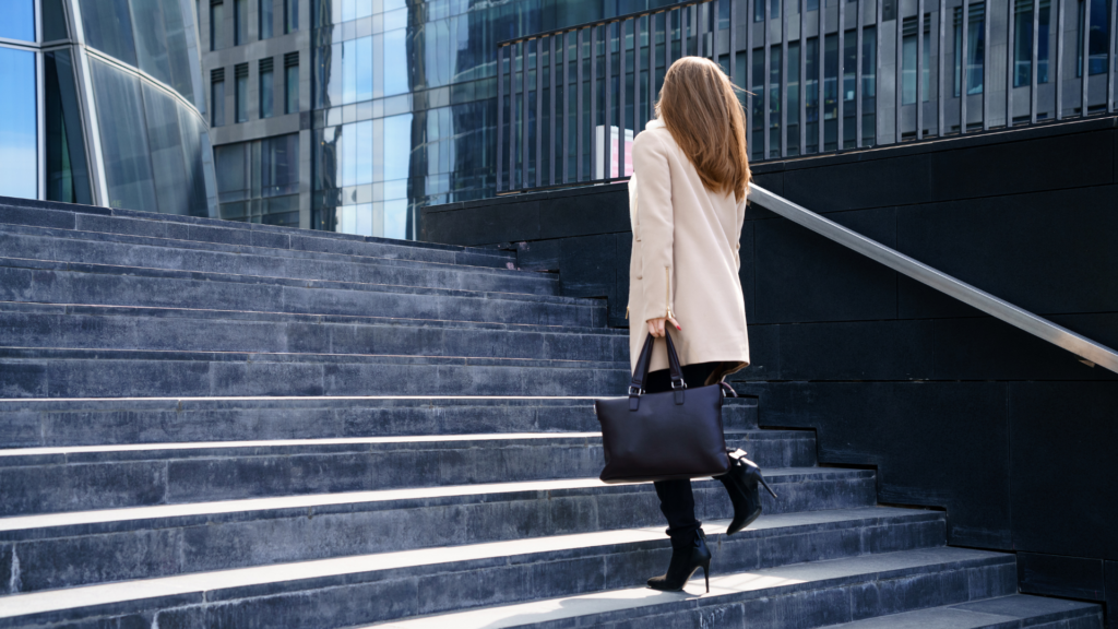 Woman taking up stairs 